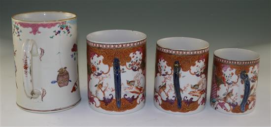 A graduated set of three Chinese export famille rose mugs and another larger, Qianlong period, 10cm-13cm and 16.5cm (4)